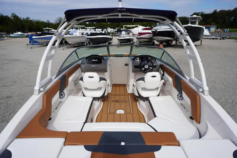 Slide: The Image of 2023 Chaparral 23 SSi OB boat interior with seating and steering wheel. - 42