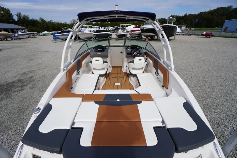 Slide: The Image of 2023 Chaparral 23 SSi OB boat interior with stylish seating and modern dashboard. - 48