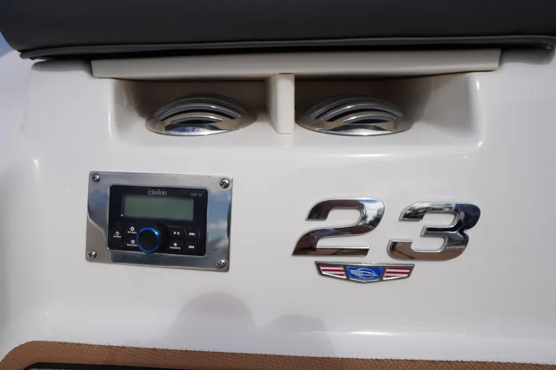Slide: The Image of 2023 Chaparral 23 SSi OB boat dashboard with Clarion stereo system. - 5