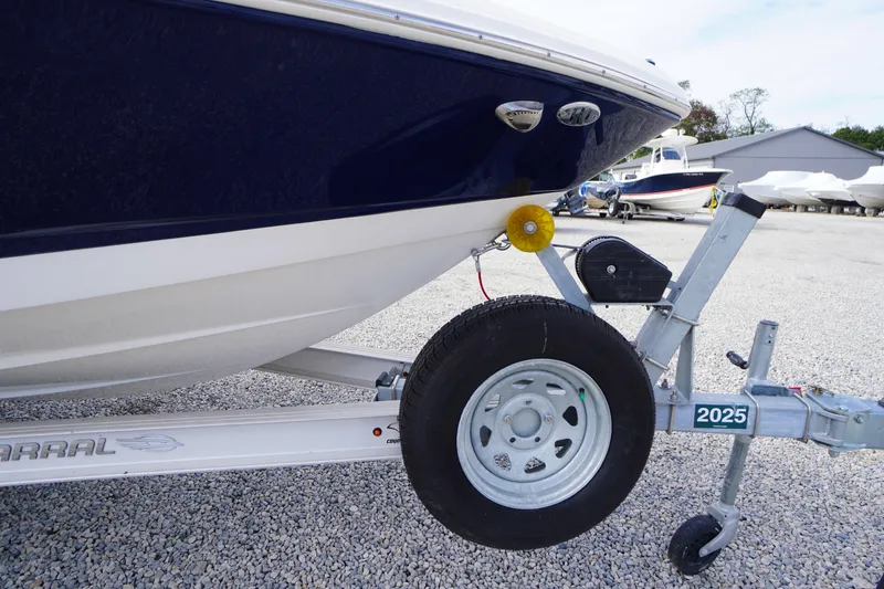 Slide: The Image of 2023 Chaparral 23 SSi OB boat on trailer, close-up view. - 57
