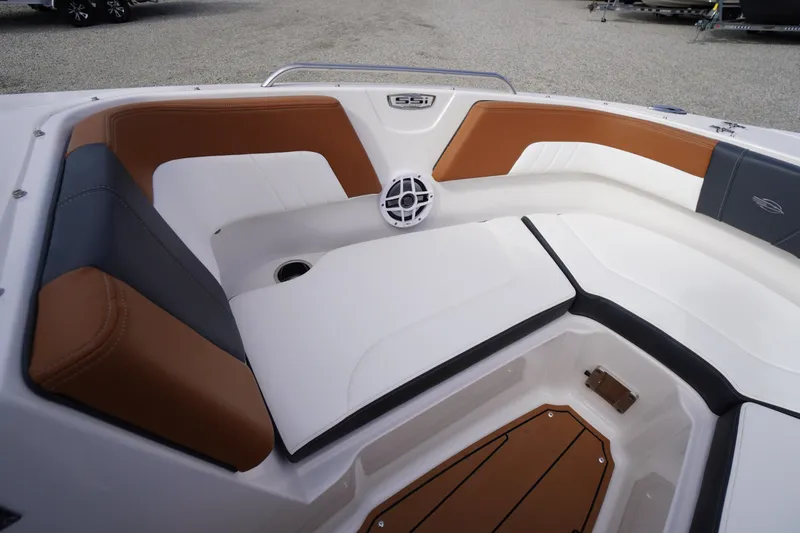 Slide: The Image of 2023 Chaparral 23 SSi OB boat interior with brown and white seating. - 9