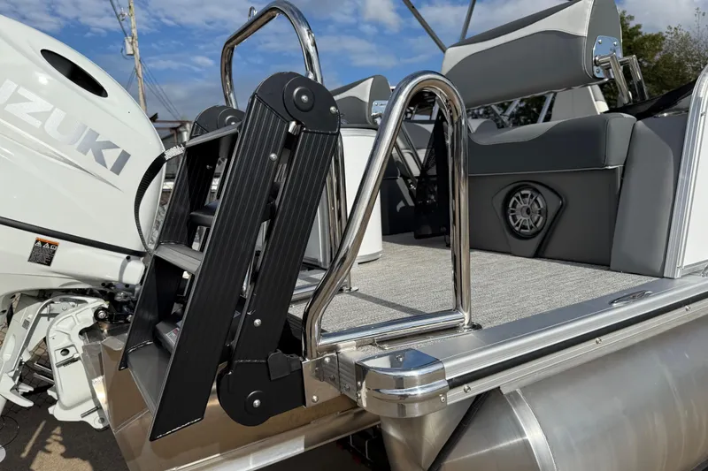 Slide: The Image of 2026 Avalon LSZ Quad Lounger Shift boat with Suzuki engine and sleek ladder design. - 11