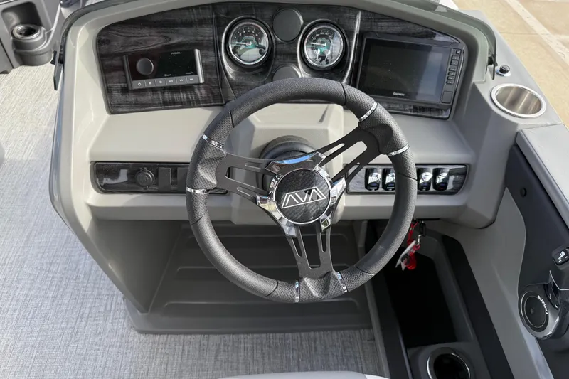Slide: The Image of Steering console of 2026 Avalon LSZ Quad Lounger Shift with modern controls and gauges. - 20