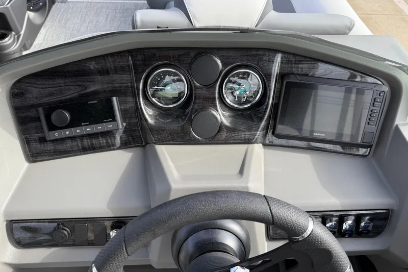 Slide: The Image of Dashboard of 2026 Avalon LSZ Quad Lounger Shift with gauges and Garmin display. - 21