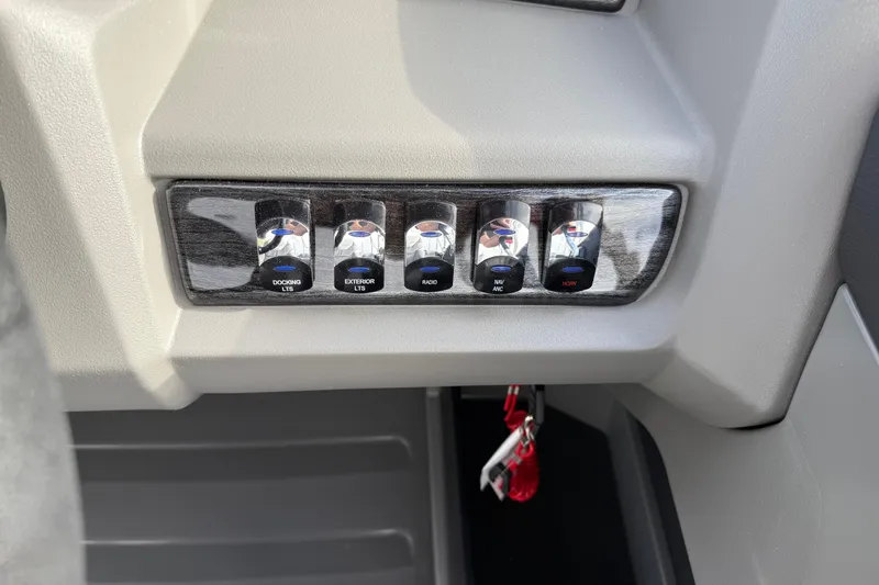 Slide: The Image of Control panel of 2026 Avalon LSZ Quad Lounger Shift with labeled switches. - 23