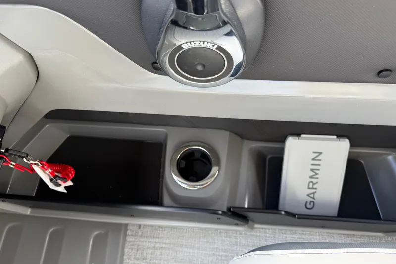 Slide: The Image of 2026 Avalon LSZ Quad Lounger Shift console with Suzuki control and Garmin device. - 24