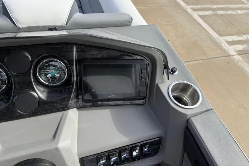 Slide: The Image of Dashboard of 2026 Avalon LSZ Quad Lounger Shift with Garmin display and cup holder. - 25