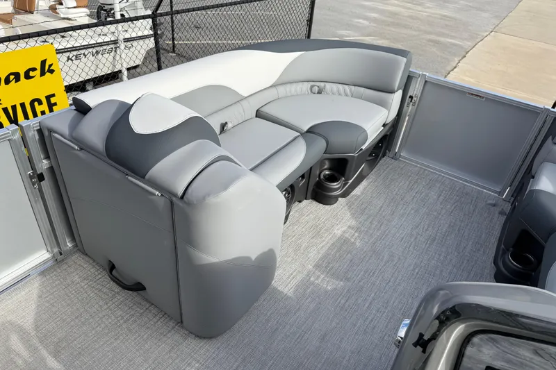Slide: The Image of 2026 Avalon LSZ Quad Lounger Shift boat interior with gray seating and carpeted flooring. - 27