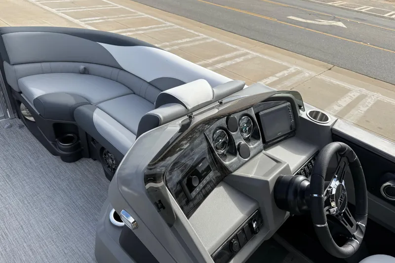 Slide: The Image of 2026 Avalon LSZ Quad Lounger Shift boat interior with sleek dashboard and comfortable seating. - 28