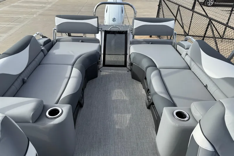 Slide: The Image of 2026 Avalon LSZ Quad Lounger Shift boat interior with gray seating and cup holders. - 29