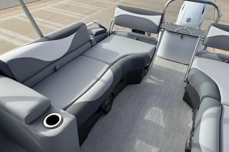 Slide: The Image of 2026 Avalon LSZ Quad Lounger Shift boat interior with gray seating and cup holders. - 33