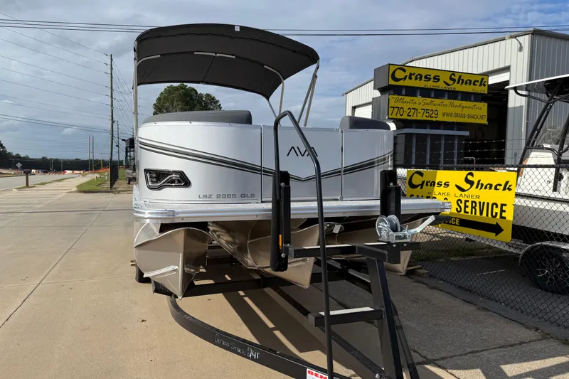 Slide: The Image of 2026 Avalon LSZ QUAD LOUNGER SHIFT pontoon boat displayed at dealership. - 4