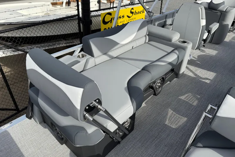 Slide: The Image of 2026 Avalon LSZ Quad Lounger Shift boat interior with gray seating and cup holders. - 41