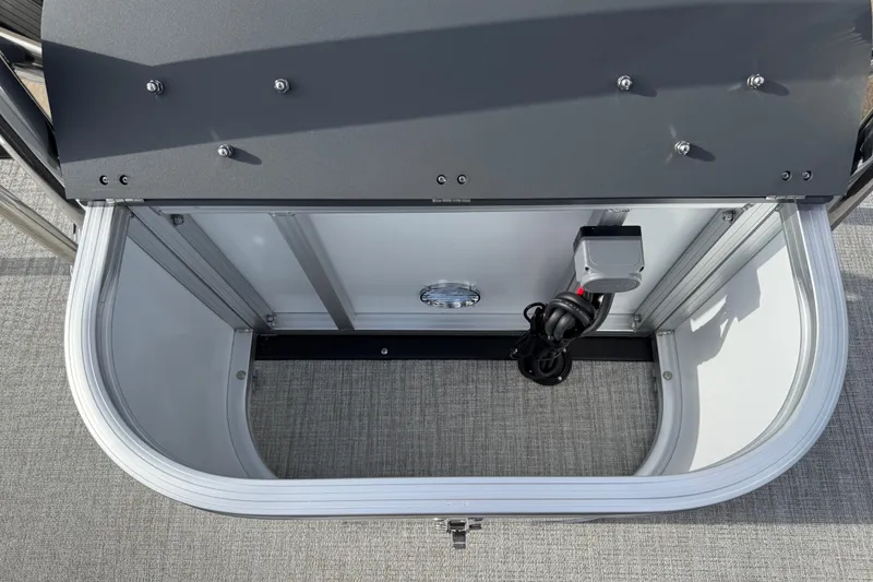 Slide: The Image of Open storage compartment in 2026 Avalon LSZ Quad Lounger Shift boat. - 44