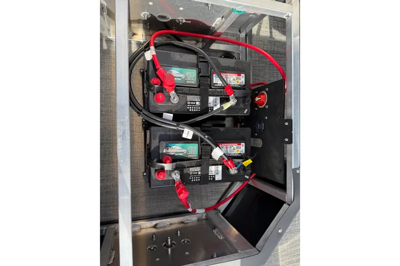 Slide: The Image of Battery compartment of 2026 Avalon LSZ Quad Lounger Shift with wiring and connectors. - 45