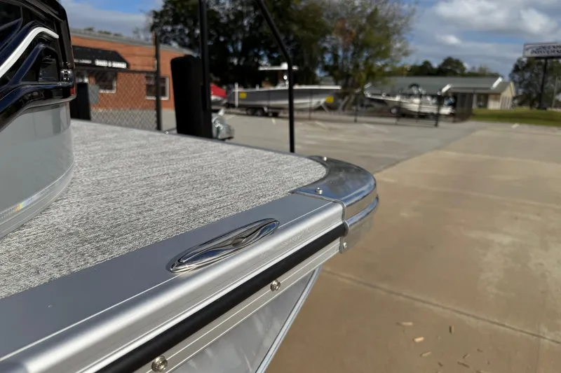 Slide: The Image of 2026 Avalon LSZ Quad Lounger Shift boat detail in outdoor showroom setting. - 59