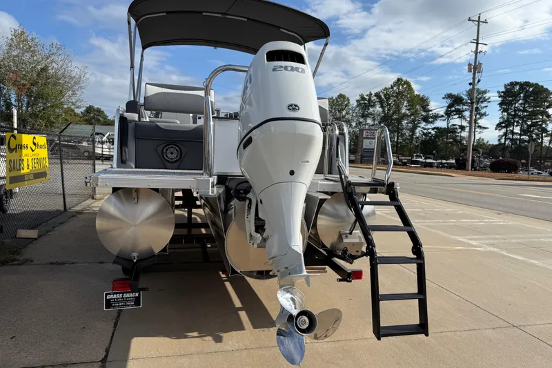 Slide: The Image of 2026 Avalon LSZ Quad Lounger Shift pontoon boat with powerful outboard motor. - 6