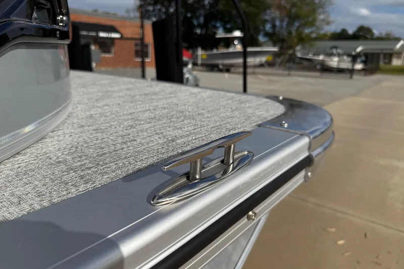 Slide: The Image of 2026 Avalon LSZ Quad Lounger Shift boat detail with cleat and textured surface. - 60