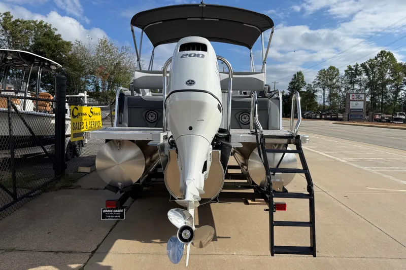 Slide: The Image of 2026 Avalon LSZ Quad Lounger Shift pontoon boat with powerful outboard motor. - 7