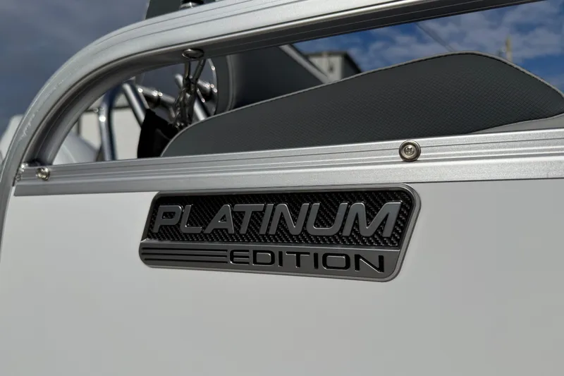 Slide: The Image of 2026 Avalon LSZ Quad Lounger Shift, Platinum Edition badge detail. - 9