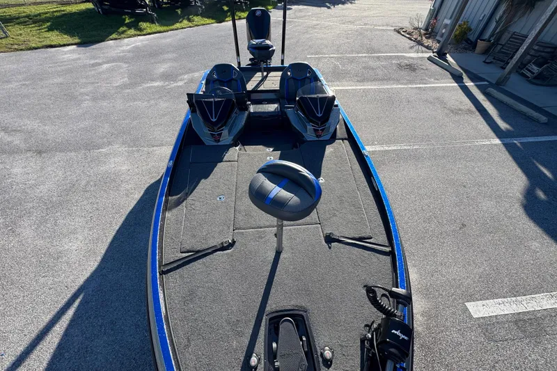 Slide: The Image of 2022 Ranger Z520R Cup-Equipped boat, blue and gray, parked on pavement. - 13