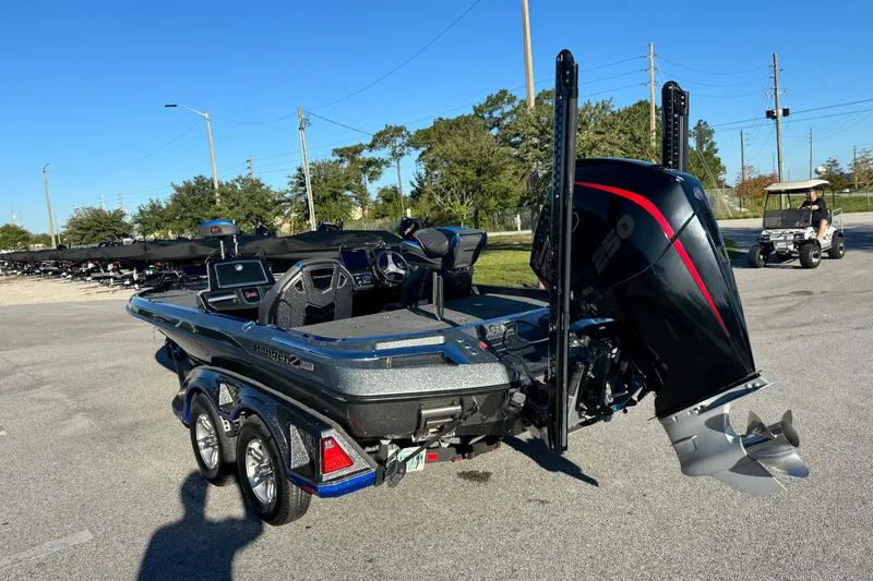 Slide: The Image of 2022 Ranger Z520R Cup-Equipped boat with powerful outboard motor in a parking lot. - 5