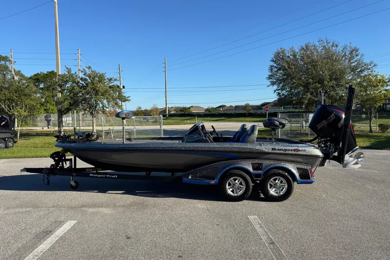 Slide: The Image of 2022 Ranger Z520R Cup-Equipped boat on trailer in parking lot, sunny day. - 7