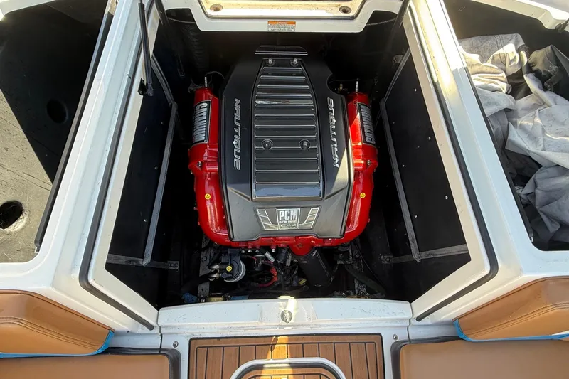 Slide: The Image of 2016 Nautique Super Air Nautique 230 engine compartment with PCM engine. - 15