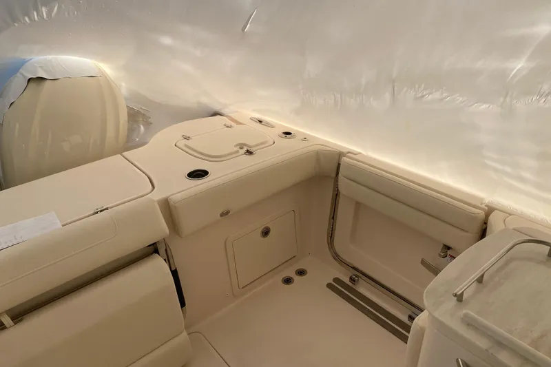 Slide: The Image of 2026 Grady-White Freedom 325 boat interior with seating and storage compartments. - 11