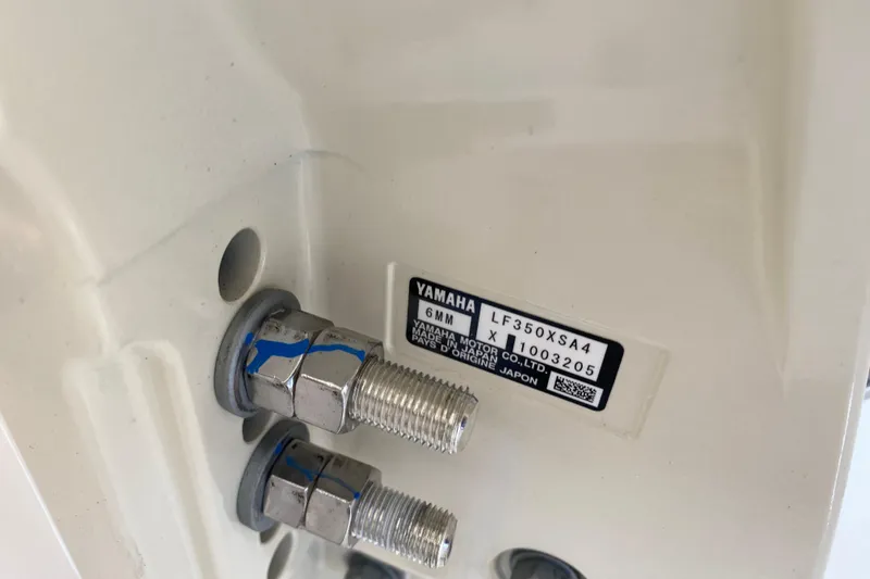 Slide: The Image of Close-up of Yamaha motor bolts on 2026 Grady-White Freedom 325 boat. - 15