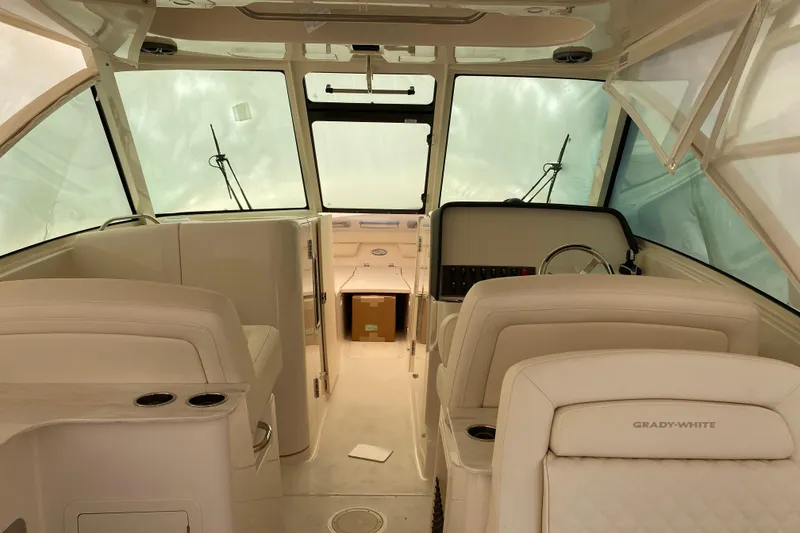 Slide: The Image of Interior of 2026 Grady-White Freedom 325 boat, featuring luxurious seating and helm. - 4