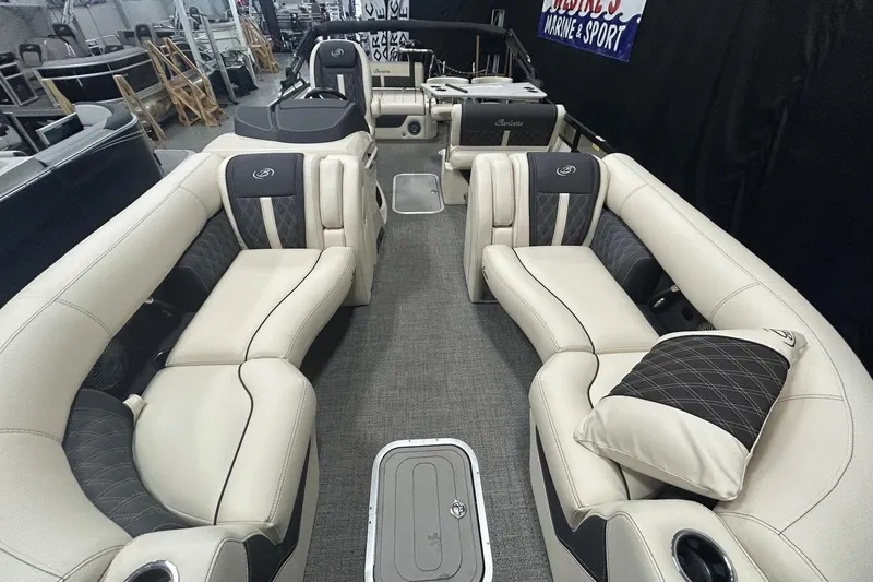 Slide: The Image of 2025 Barletta Lusso 25UE pontoon boat interior with luxurious seating and modern design. - 5