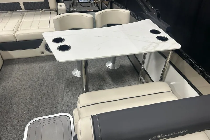 Slide: The Image of Interior of 2025 Barletta Lusso 25UE with elegant seating and a marble-style table. - 6