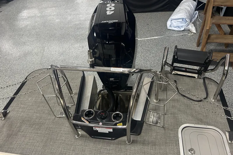 Slide: The Image of 2025 Barletta Lusso 25UE boat with Mercury 400 outboard motor, rear deck view. - 8