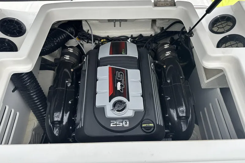 Slide: The Image of Engine compartment of a 2019 Sea Ray SPX 190 boat, featuring a powerful 250 HP engine. - 10