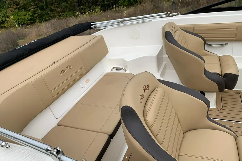 Slide: The Image of 2019 Sea Ray SPX 190 boat interior with tan and black seating. - 8