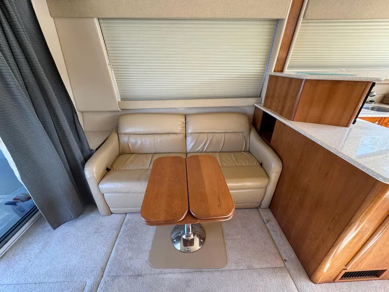 Slide: The Image of Interior of 2004 Meridian 381 Sedan with beige leather sofa and wooden table. - 19