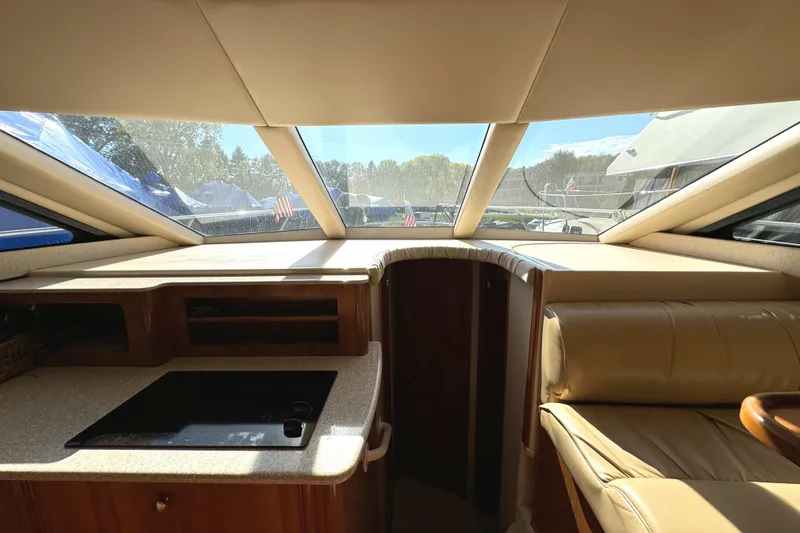 Slide: The Image of Interior view of 2004 Meridian 381 Sedan yacht with sunlit cabin and seating. - 24