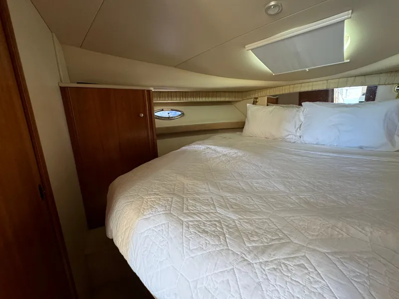 Slide: The Image of Luxurious bedroom interior of 2004 Meridian 381 Sedan yacht with cozy bedding. - 32