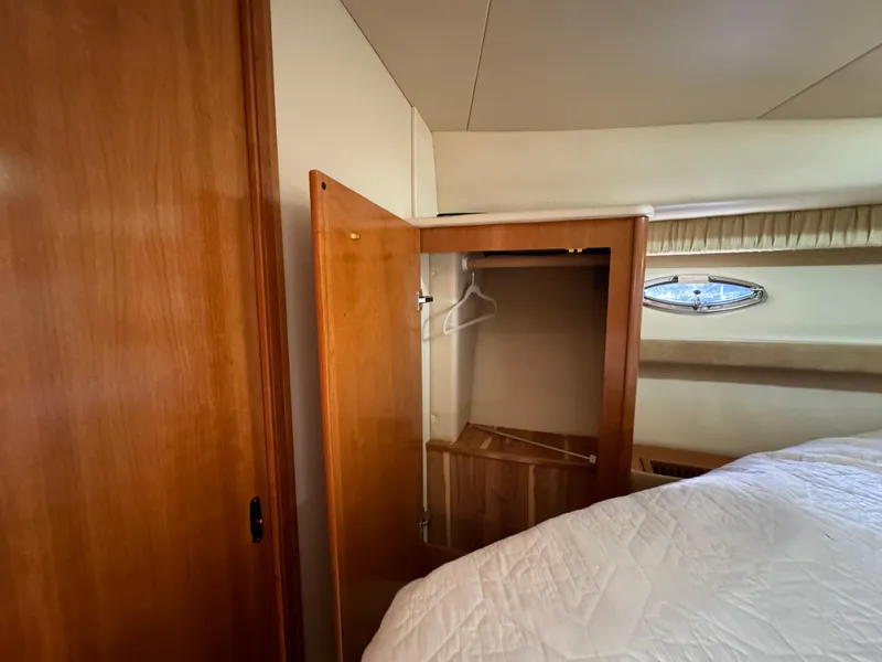 Slide: The Image of Interior of 2004 Meridian 381 Sedan with open wooden closet and bed. - 36
