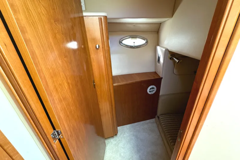 Slide: The Image of 2004 Meridian 381 Sedan interior with wood cabinetry and small window. - 37