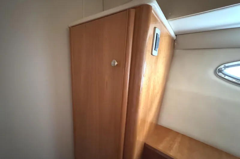 Slide: The Image of Interior of 2004 Meridian 381 Sedan, featuring wooden cabinetry and a small window. - 38