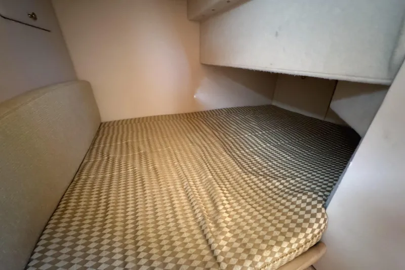 Slide: The Image of 2004 Meridian 381 Sedan cabin interior with patterned bed and storage space. - 42