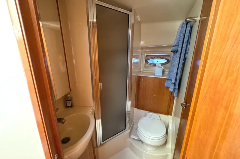Slide: The Image of 2004 Meridian 381 Sedan bathroom with shower, sink, and toilet. - 43