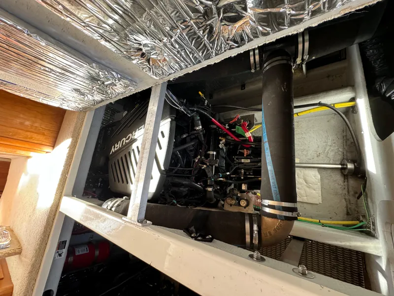 Slide: The Image of Engine compartment of a 2004 Meridian 381 Sedan with Mercury engine components. - 48