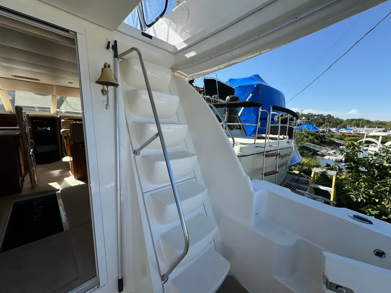 Slide: The Image of 2004 Meridian 381 Sedan yacht interior with stairs and marina view. - 7