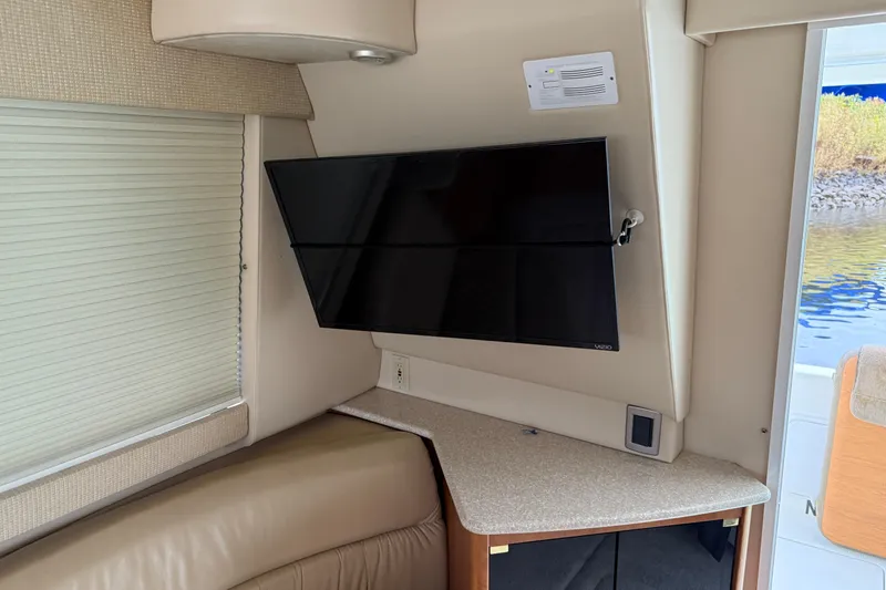 Slide: The Image of Interior of 2004 Meridian 381 Sedan with mounted TV and corner seating area. - 72