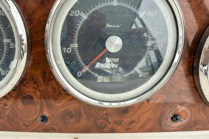 Slide: The Image of Close-up of a 2004 Meridian 381 Sedan tachometer displaying RPM and hours. - 73
