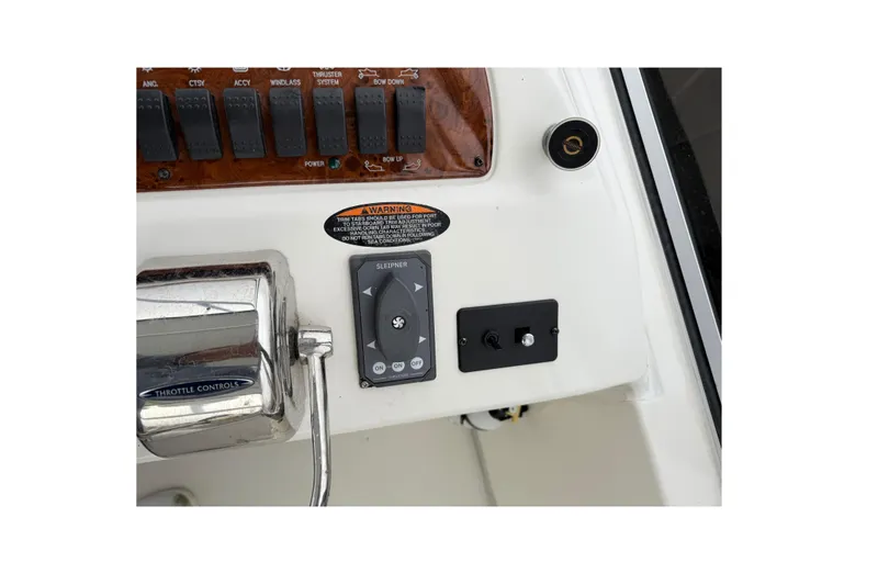 Slide: The Image of Control panel of 2004 Meridian 381 Sedan boat with throttle and switches. - 74