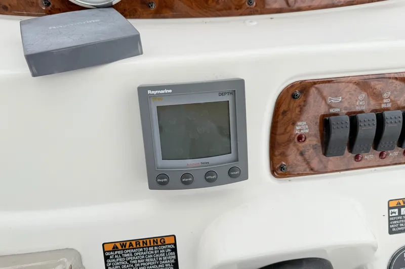 Slide: The Image of Raymarine ST60 depth display on 2004 Meridian 381 Sedan boat dashboard. - 75